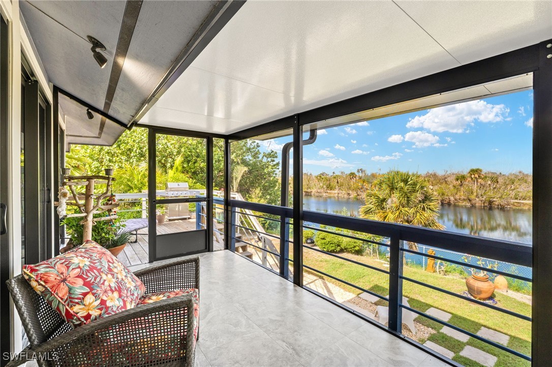 771 Rabbit Road Sanibel, FL 33957 - Photo 21 of 35 a living room with large windows
