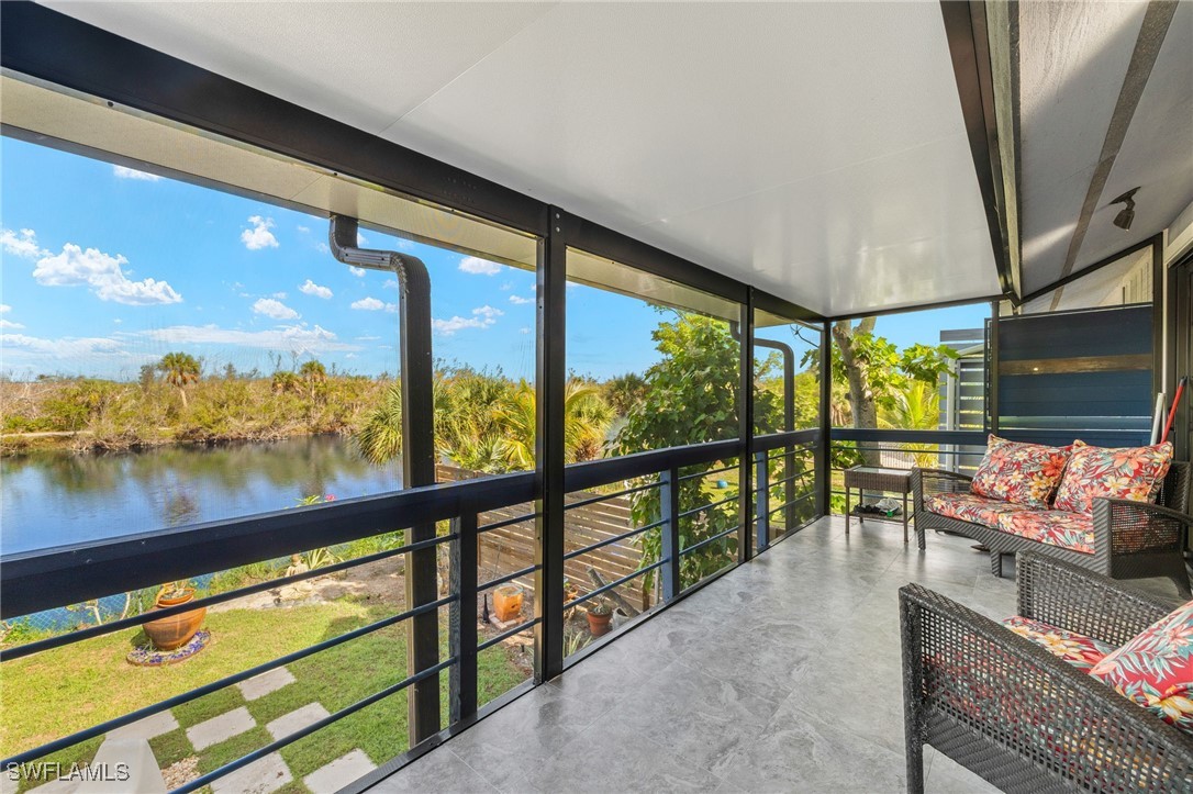771 Rabbit Road Sanibel, FL 33957 - Photo 22 of 35 a view of two chairs in the balcony