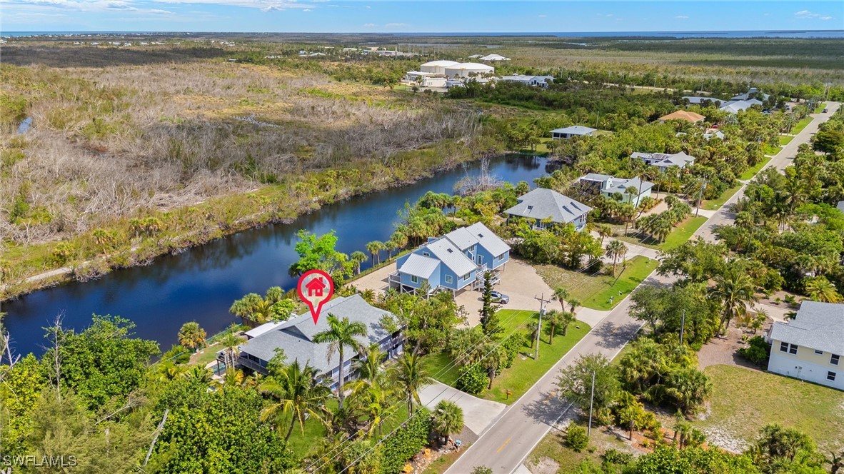 771 Rabbit Road Sanibel, FL 33957 - Photo 31 of 35 an aerial view of residential houses with outdoor space and ocean view