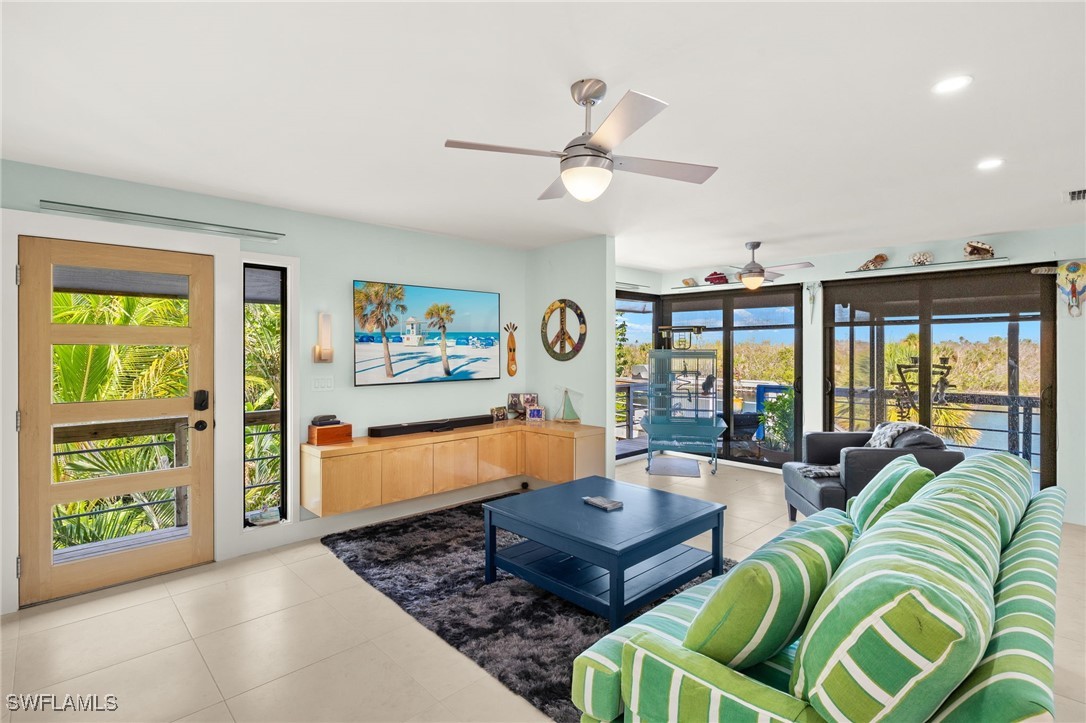 771 Rabbit Road Sanibel, FL 33957 - Photo 5 of 35 a living room with furniture and a large window