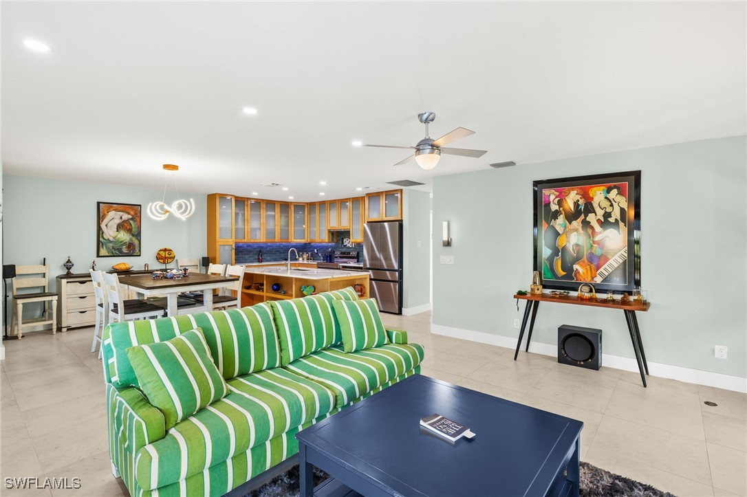 771 Rabbit Road Sanibel, FL 33957 - Photo 6 of 35 a living room with furniture and a flat screen tv