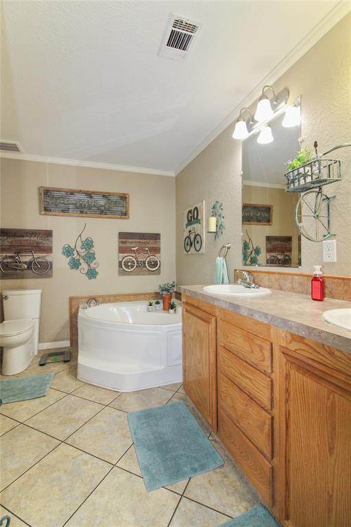 455 Hughes Cemetery Road Italy, TX 76651 - Photo 17 of 40 a bathroom with a tub sink and a mirror