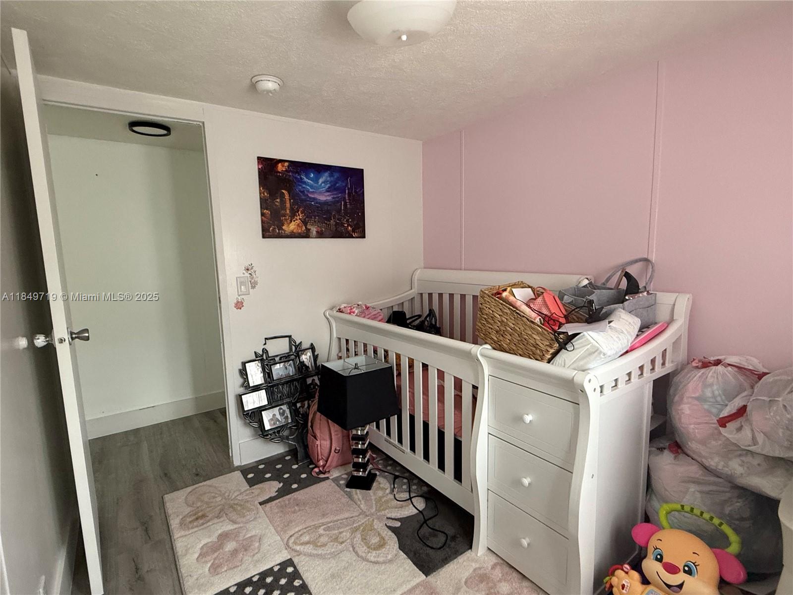 830 South Kennel Street Clewiston, FL 33440 - Photo 13 of 30 a bedroom with a bed and a window