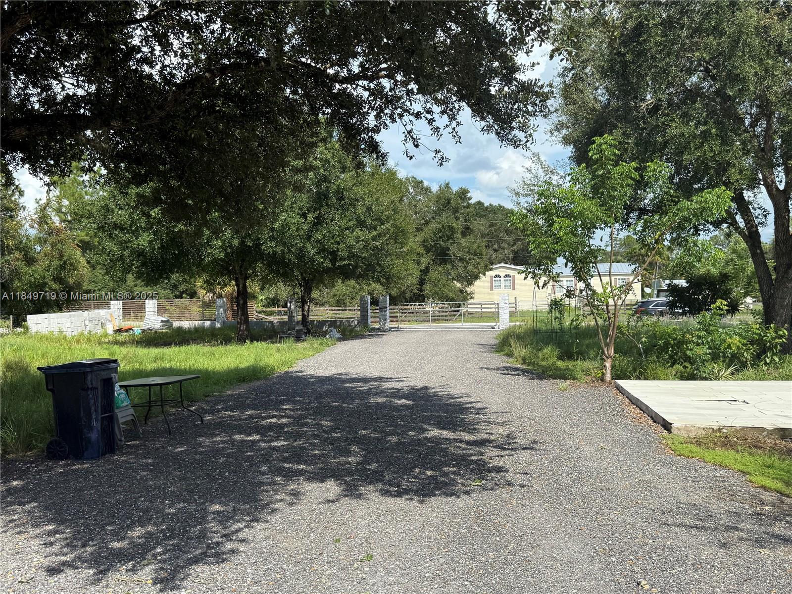 830 South Kennel Street Clewiston, FL 33440 - Photo 18 of 30 a view of a park with large trees