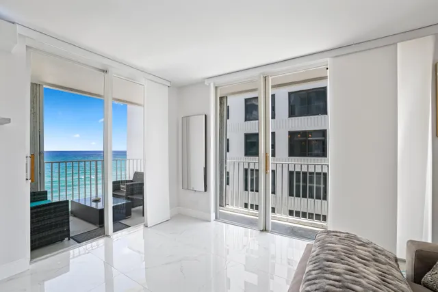 a view of livingroom with furniture and floor to ceiling window