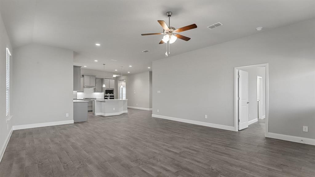 11209 Treehouse Trail Justin, TX 76247 - Photo 10 of 40 a view of a kitchen with wooden floor