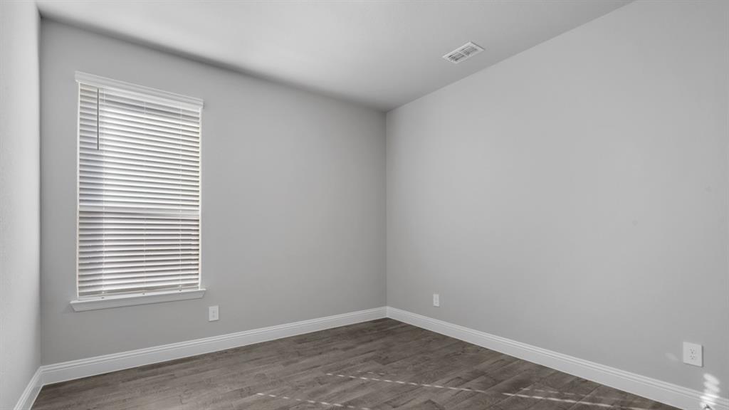11209 Treehouse Trail Justin, TX 76247 - Photo 28 of 40 an empty room with a window