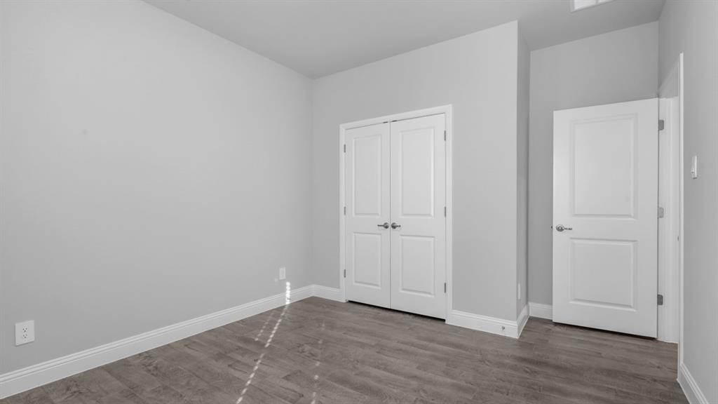 11209 Treehouse Trail Justin, TX 76247 - Photo 29 of 40 a view of an empty room with wooden floor