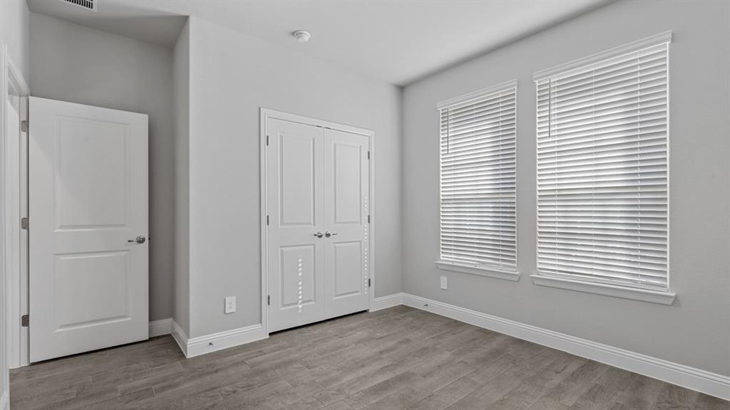 11209 Treehouse Trail Justin, TX 76247 - Photo 34 of 40 a view of an empty room with window and a bathroom
