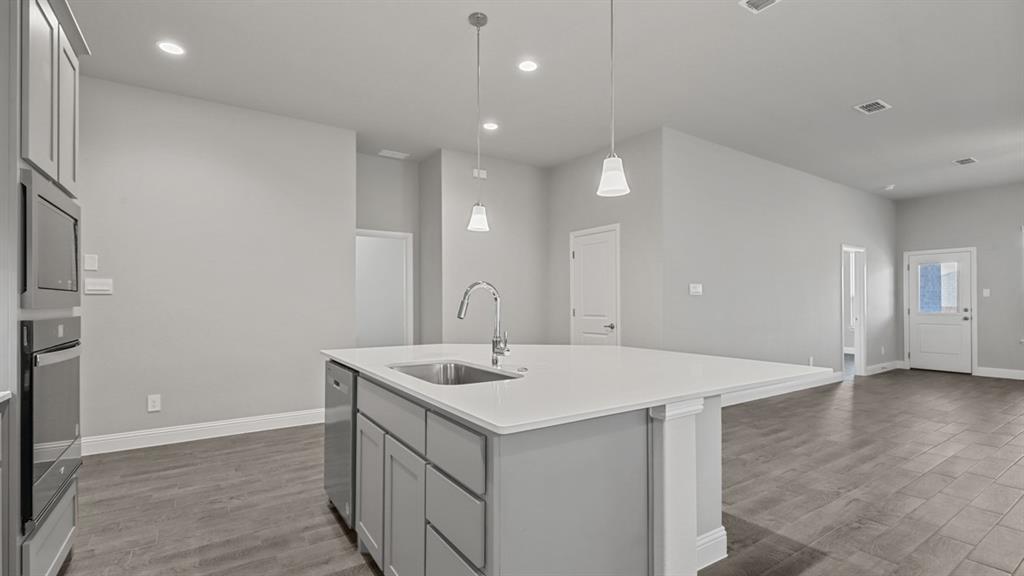 11209 Treehouse Trail Justin, TX 76247 - Photo 4 of 40 a view of a sink a bathroom and mirror