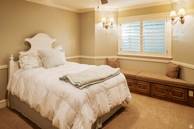 875 South 1250th Street East Mapleton, UT 84664 - Photo 52 of 54 Bedroom featuring crown molding, neutral wall tones, plantation shutters, a built-in window bench with storage, and wall sconces