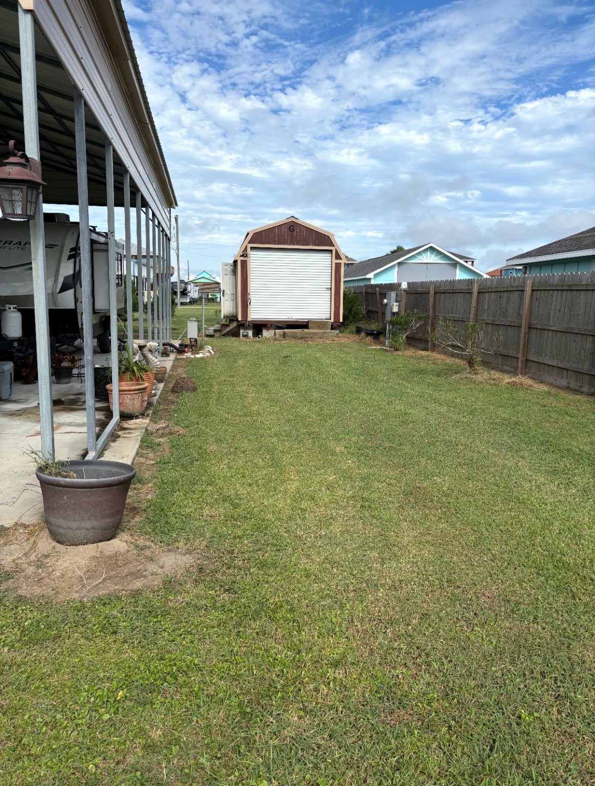 920 South Sage Road Crystal Beach, TX 77650 - Photo 3 of 6 a front view of a house with garden