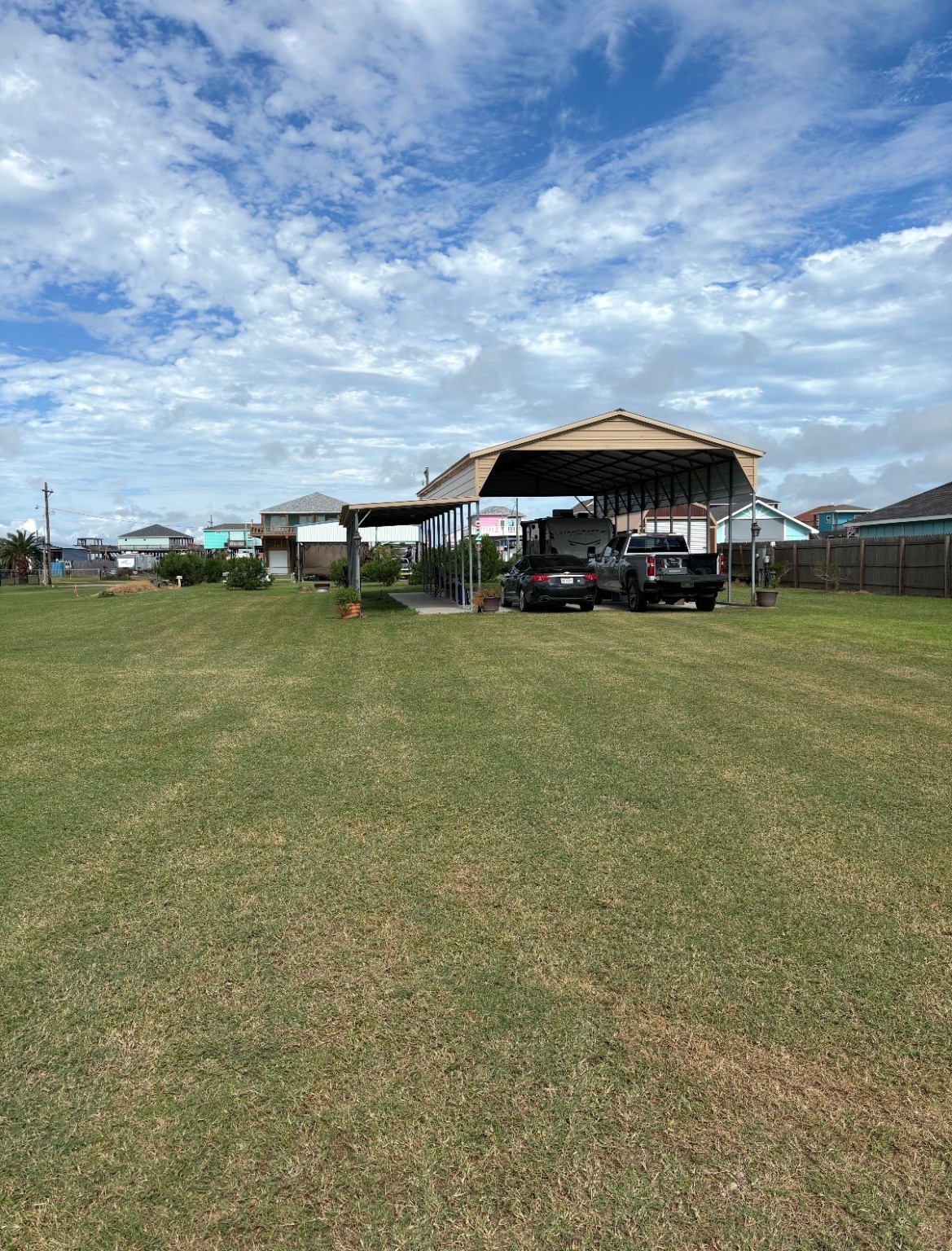 920 South Sage Road Crystal Beach, TX 77650 - Photo 4 of 6 a view of a lake with a big yard