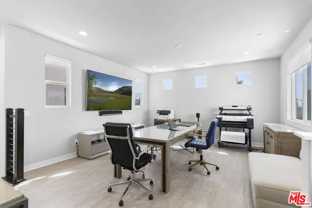 a workspace with furniture and window