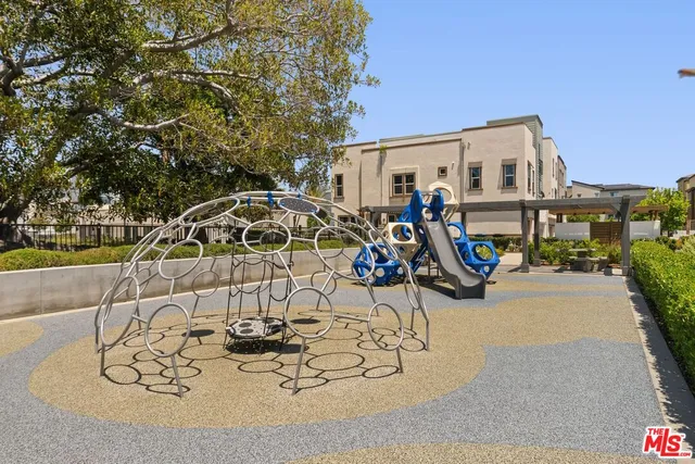 a view of a patio with table and chairs