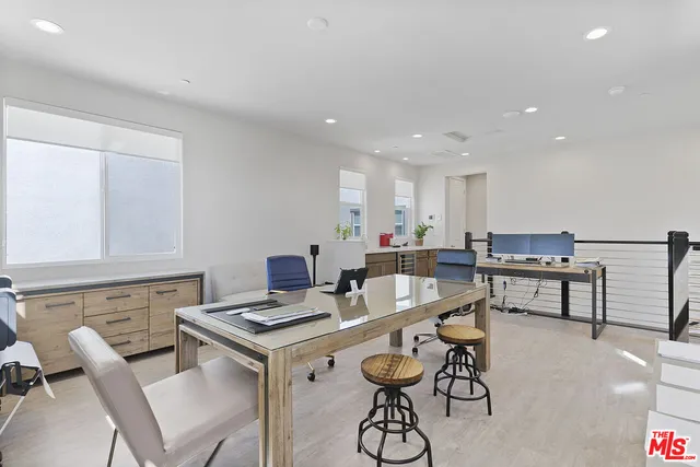 a bathroom with a sink double vanity granite and a mirror