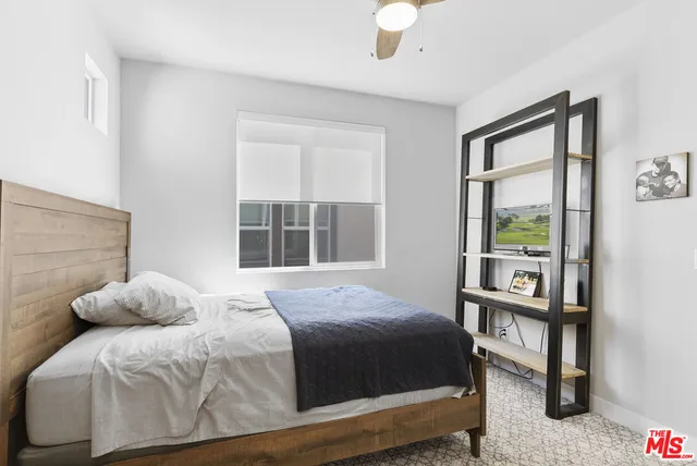 a bathroom with a sink vanity granite and a mirror