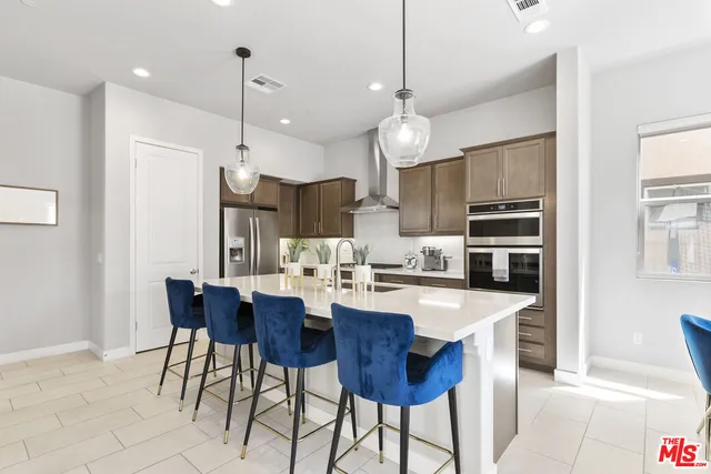 a bedroom with a bed and a dresser next to it