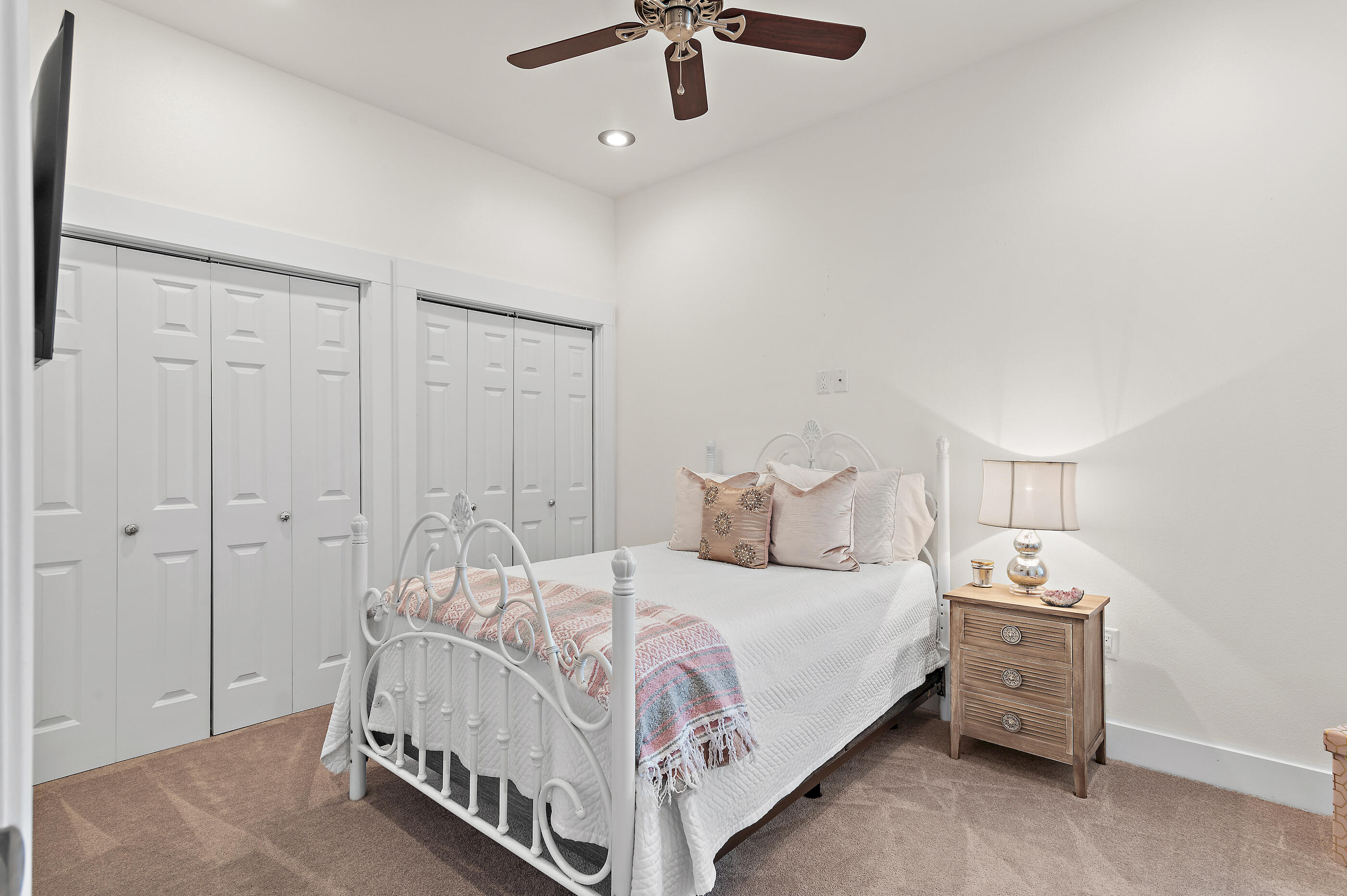96 Hilltop Drive Santa Rosa Beach, FL 32459 - Photo 29 of 50 a bedroom with a bed and a chandelier