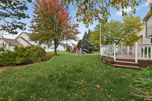 a view of a garden with wooden fence