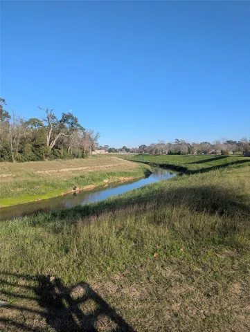 a view of a swimming pool with an outdoor seating