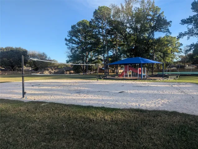 a view of a playground with a patio