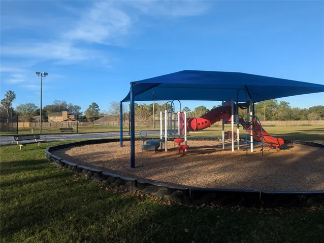 a view of a swimming pool with a yard