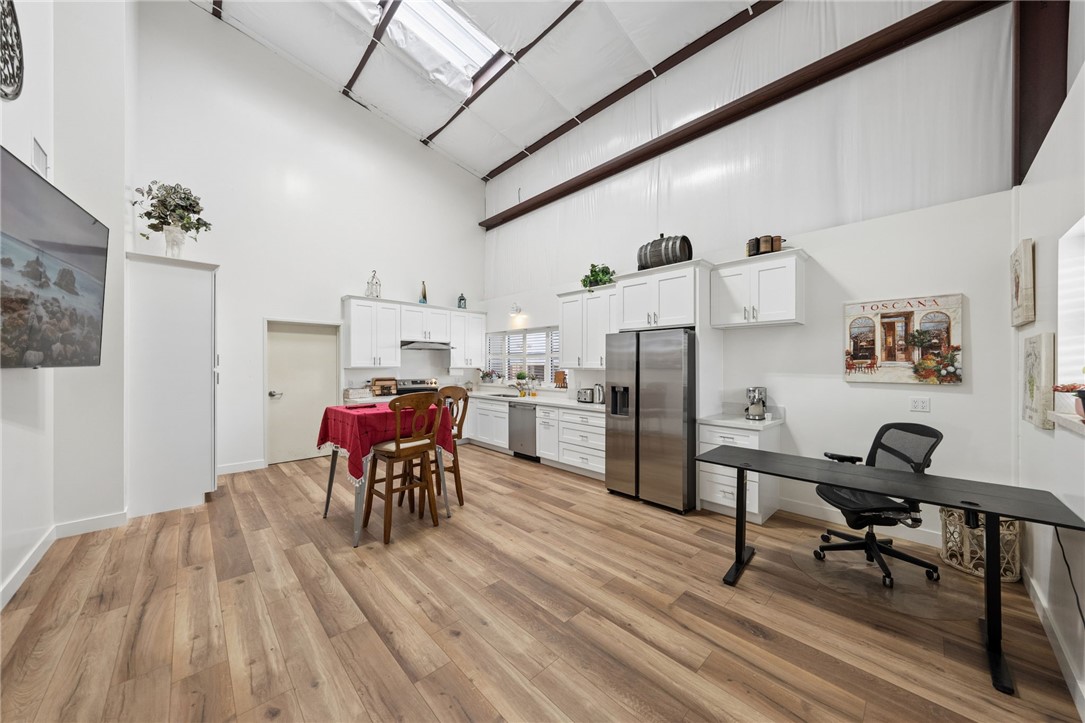 35825 Meadow Ridge Road Temecula, CA 92592 - Photo 66 of 75 a view of a dining room with furniture and wooden floor