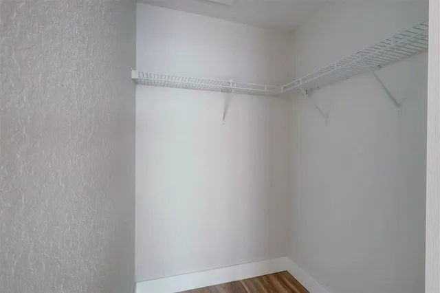 a view of an empty walk in closet