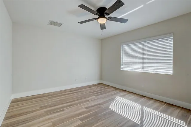 a view of room window and wooden floor