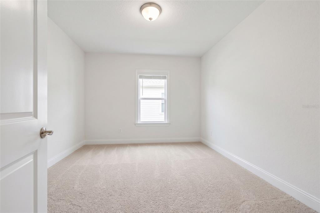2429 Twin Lake View Road Winter Haven, FL 33881 - Photo 26 of 37 an empty room with a window