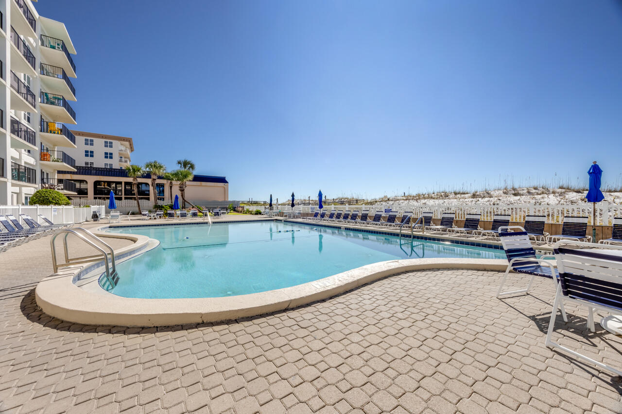 1114 Santa Rosa Boulevard, Unit 208 Fort Walton Beach, FL 32548 - Photo 42 of 73 a view of a swimming pool with outdoor seating