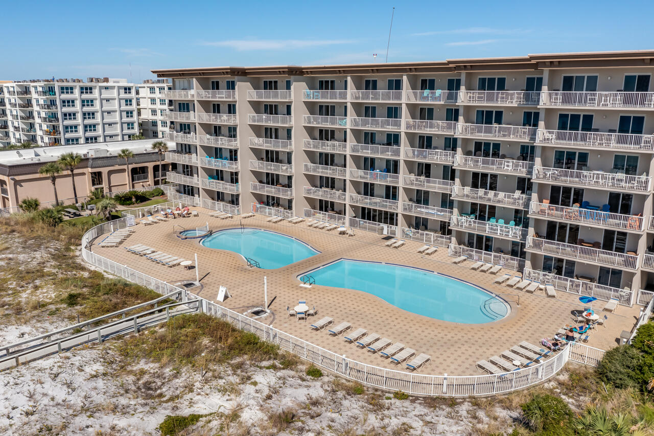 1114 Santa Rosa Boulevard, Unit 208 Fort Walton Beach, FL 32548 - Photo 62 of 73 a view of a swimming pool with outdoor seating