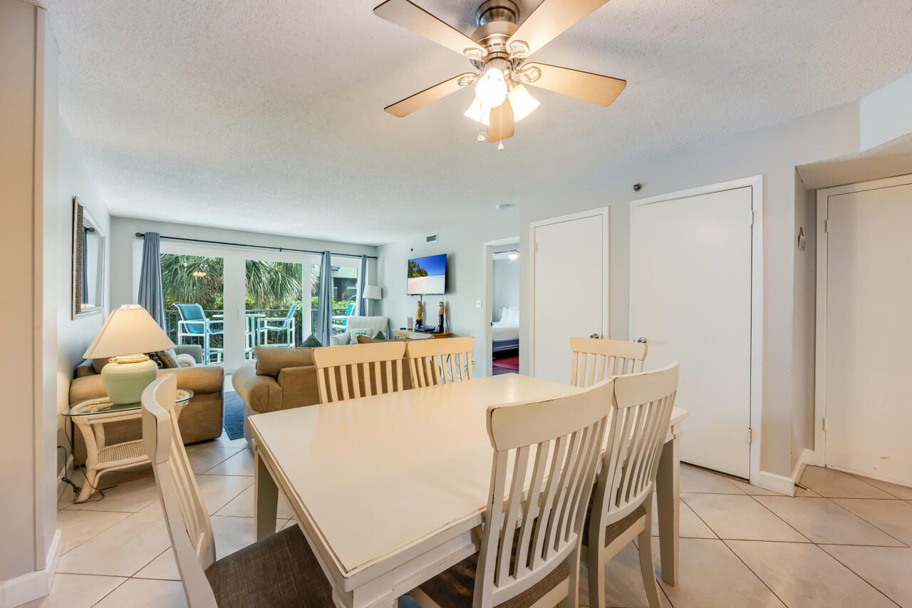 1114 Santa Rosa Boulevard, Unit 208 Fort Walton Beach, FL 32548 - Photo 10 of 73 a view of a dining room with furniture window and outside view