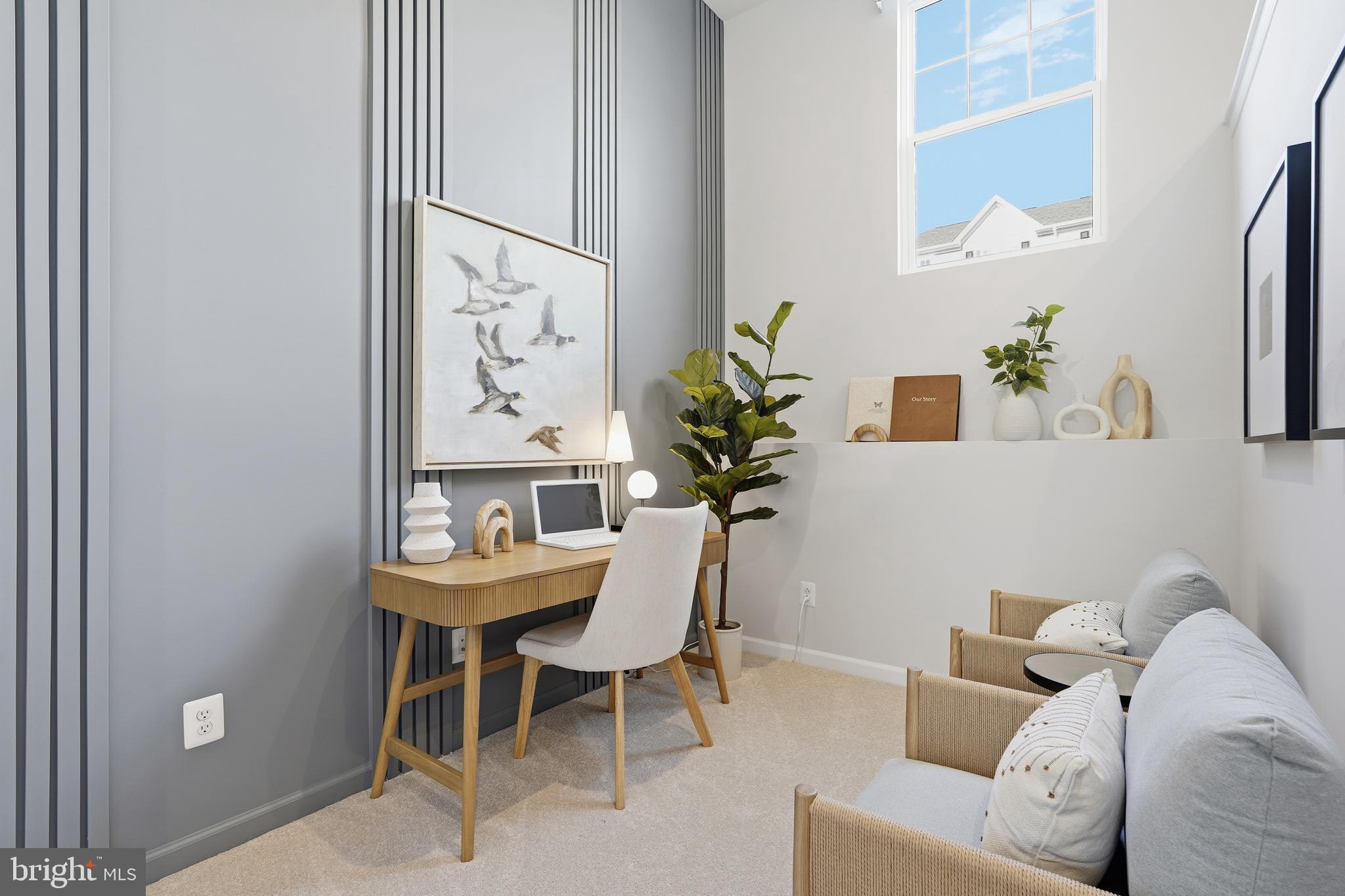 360 Anthem Street, Unit 445 Ranson, WV 25438 - Photo 66 of 87 a living room with furniture a table and a painting on the wall