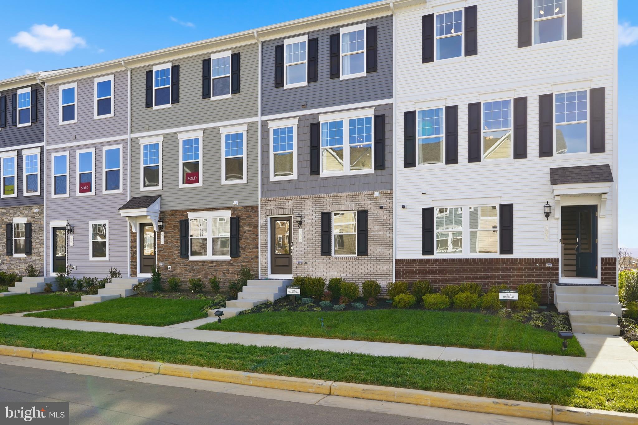 360 Anthem Street, Unit 445 Ranson, WV 25438 - Photo 68 of 87 a front view of a house with a yard