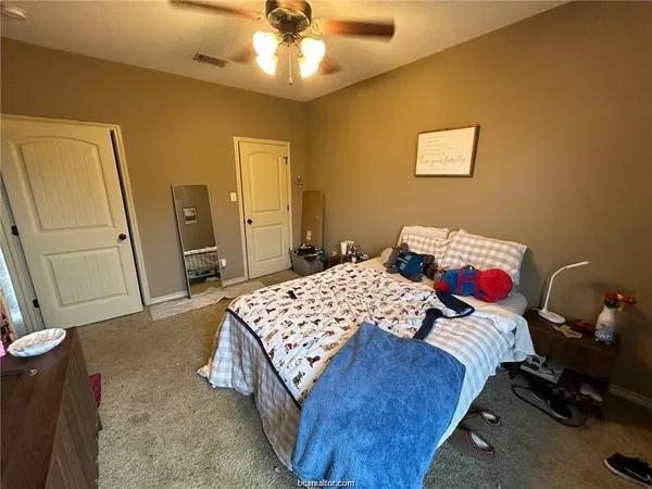 a bedroom with a bed and furniture