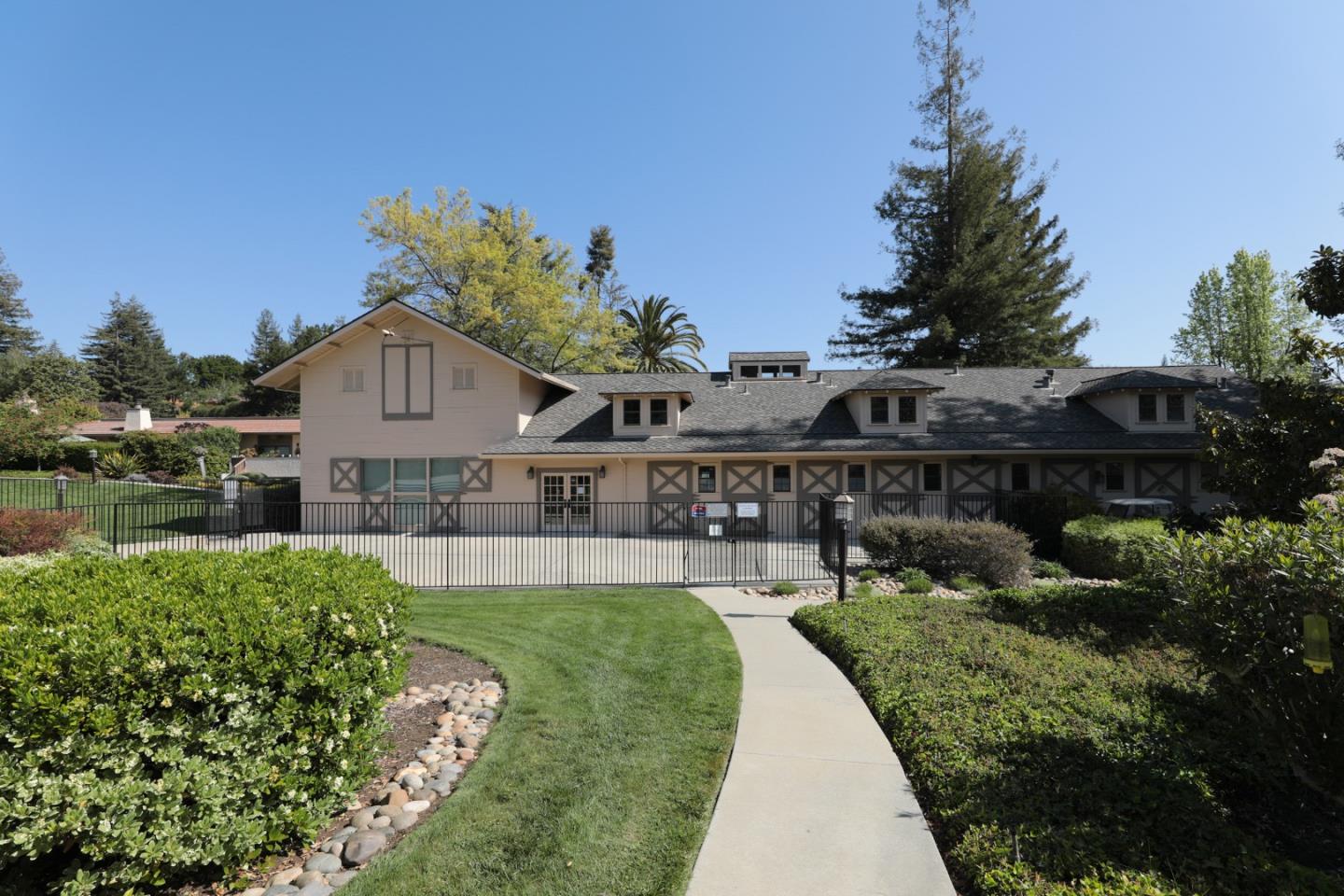 22415 Rancho Deep Cliff Drive Cupertino, CA 95014 - Photo 30 of 33 a front view of a house with a yard