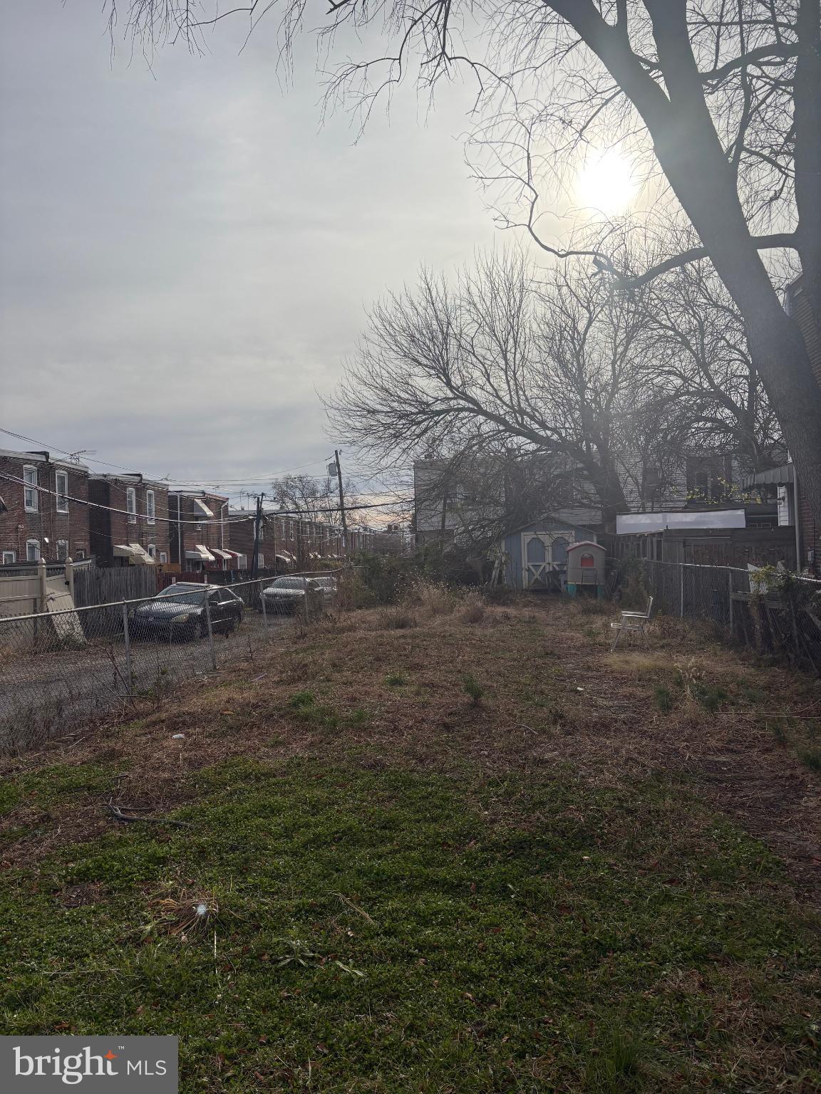 6151 Walker Street Philadelphia, PA 19135 - Photo 2 of 2 Expansive lot under a cloudy sky.