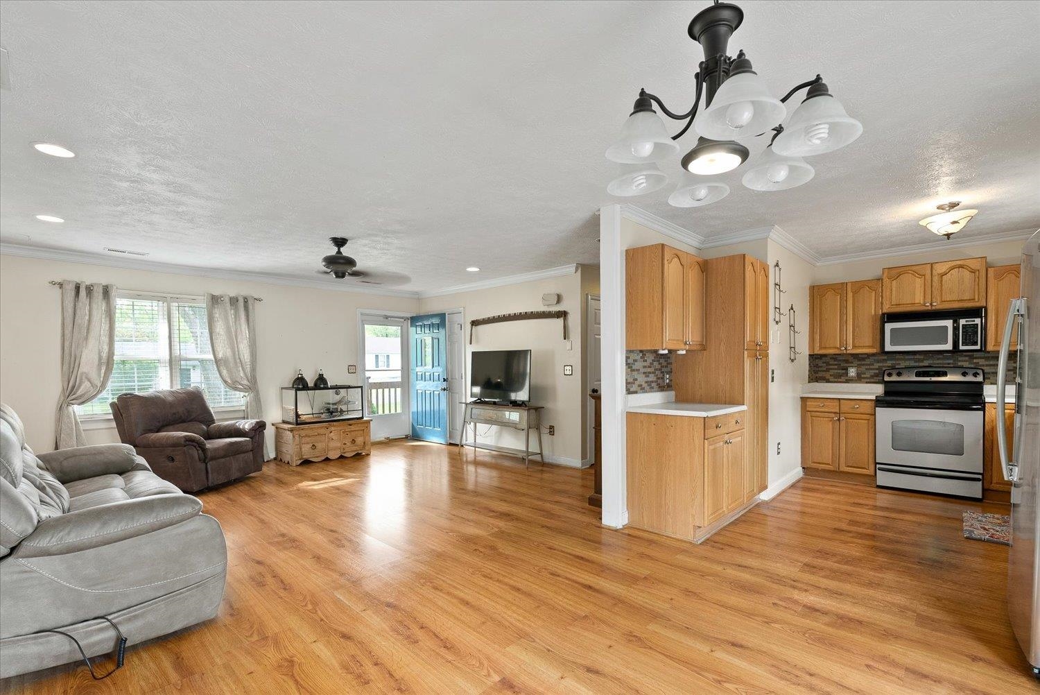 13 Buckboard Road Waynesboro, VA 22980 - Photo 11 of 29 a living room with stainless steel appliances furniture a fireplace and a view