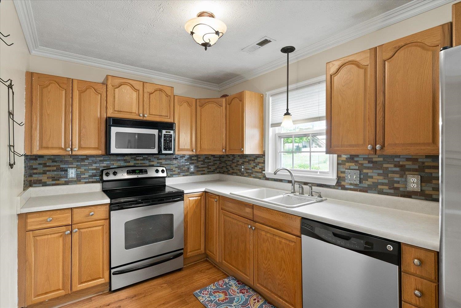 13 Buckboard Road Waynesboro, VA 22980 - Photo 12 of 29 a kitchen with stainless steel appliances a sink a stove and microwave