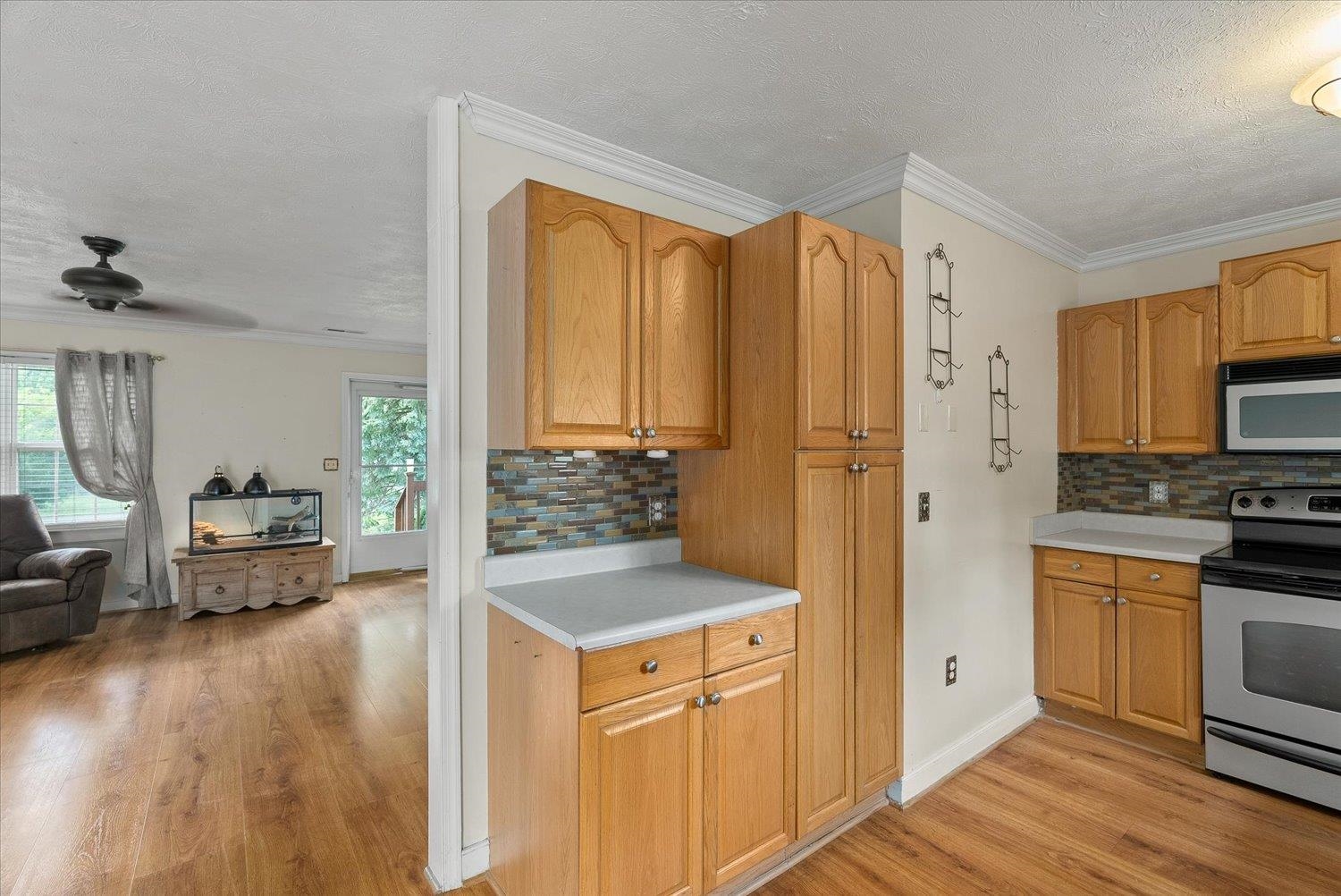 13 Buckboard Road Waynesboro, VA 22980 - Photo 13 of 29 a kitchen with stainless steel appliances granite countertop a refrigerator a stove and a sink with wooden floors