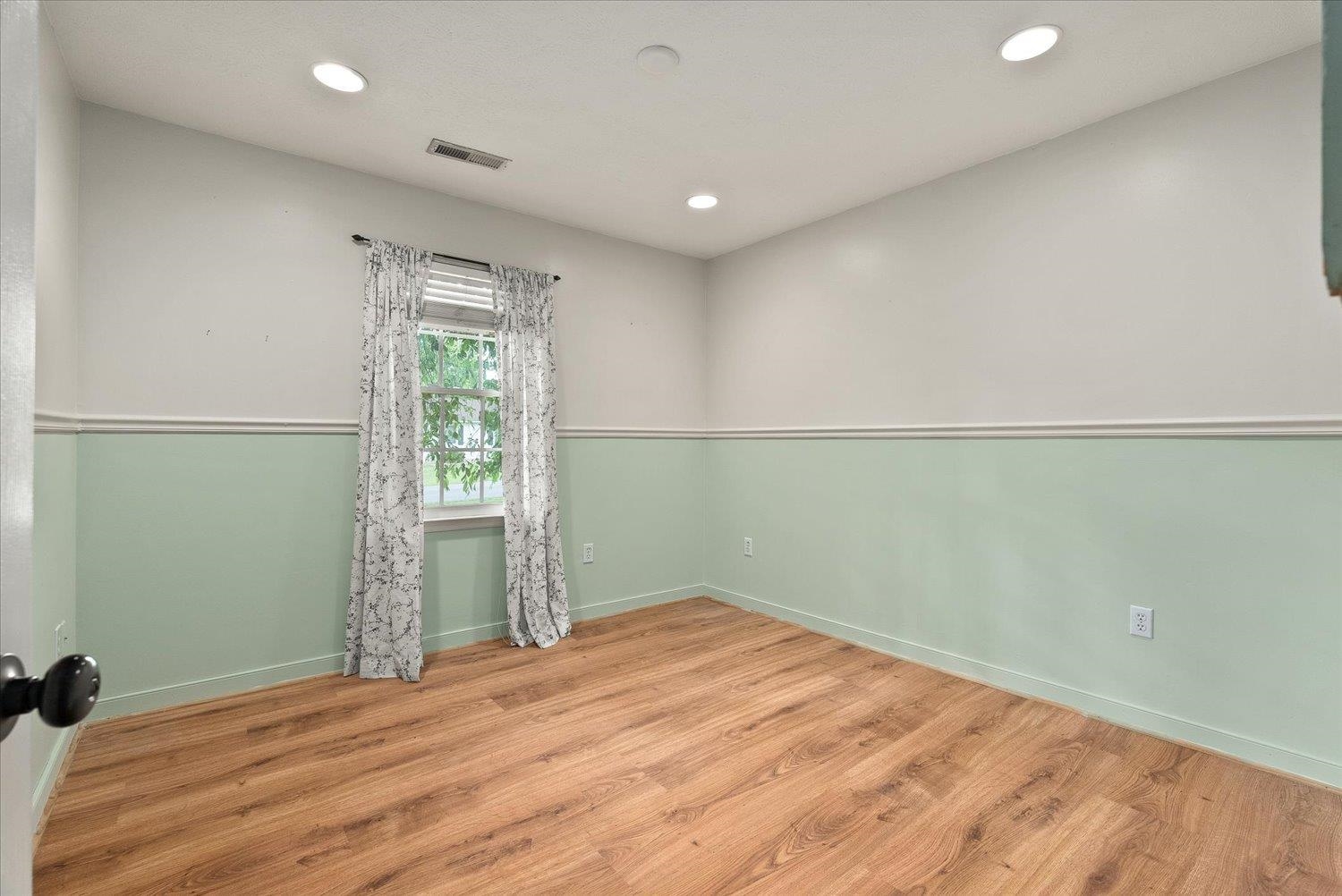 13 Buckboard Road Waynesboro, VA 22980 - Photo 17 of 29 an empty room with wooden floor and windows