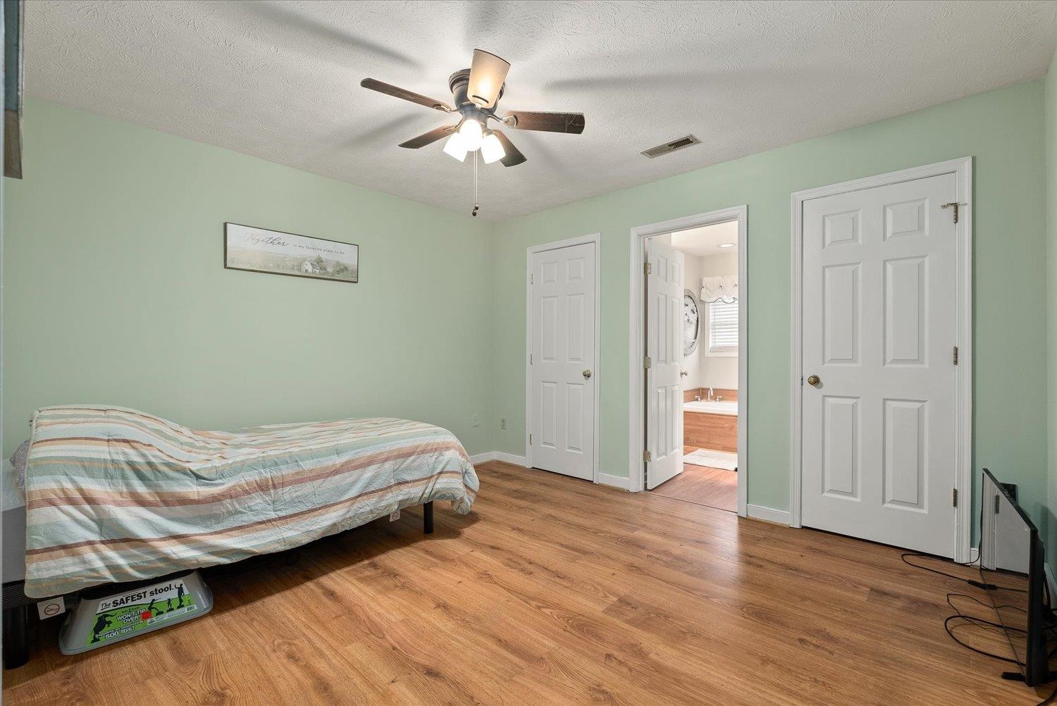 13 Buckboard Road Waynesboro, VA 22980 - Photo 19 of 29 a bedroom with a bed and a chandelier