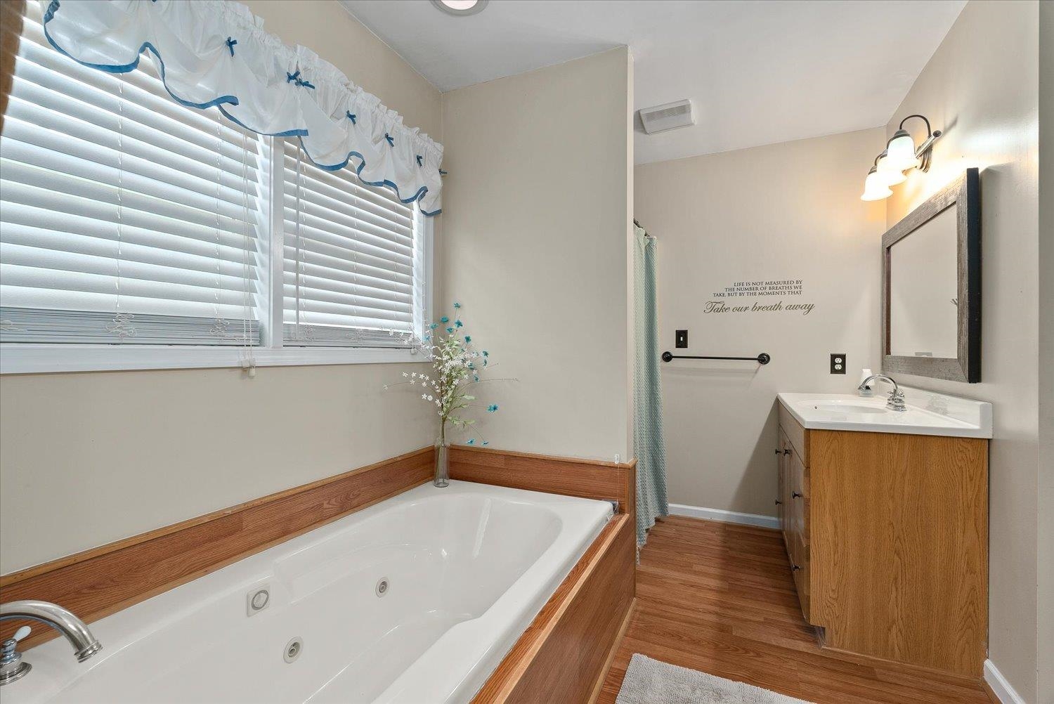 13 Buckboard Road Waynesboro, VA 22980 - Photo 21 of 29 a bathroom with a tub sink and mirror