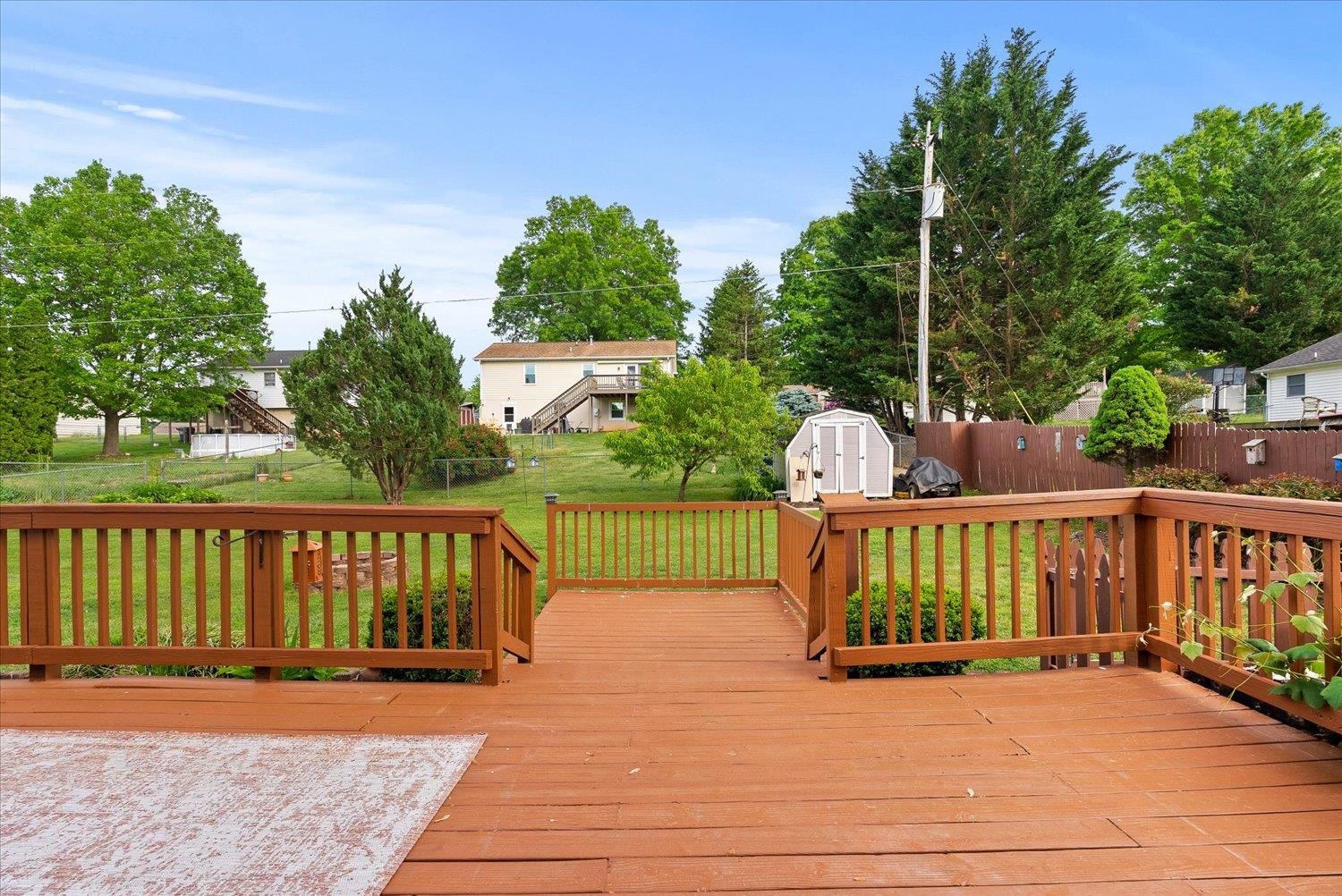 13 Buckboard Road Waynesboro, VA 22980 - Photo 23 of 29 a view of a deck with a floor to ceiling window and wooden fence