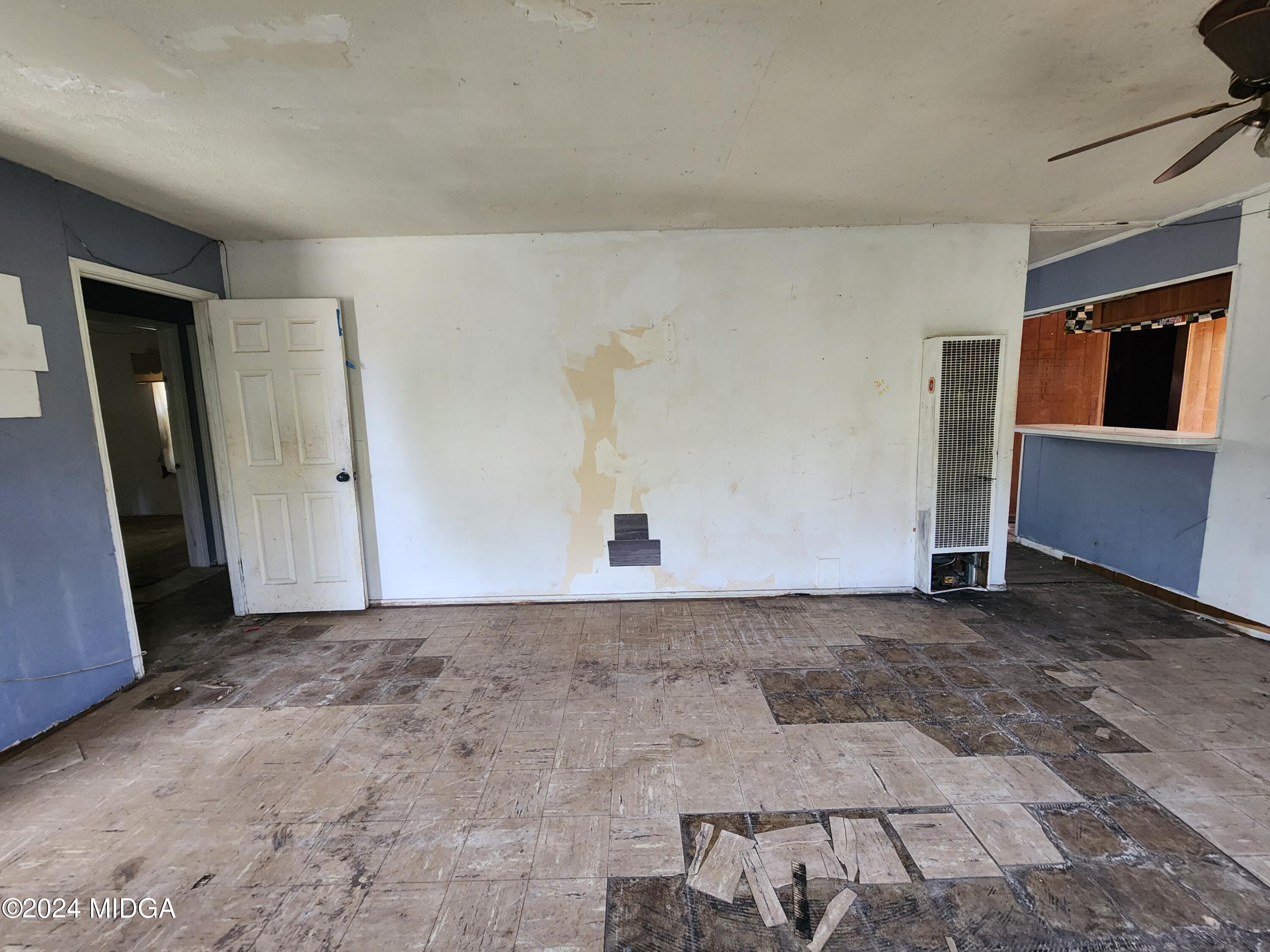 3685 Rice Mill Road Macon, GA 31206 - Photo 14 of 24 a view of a livingroom with wooden floor and cabinet