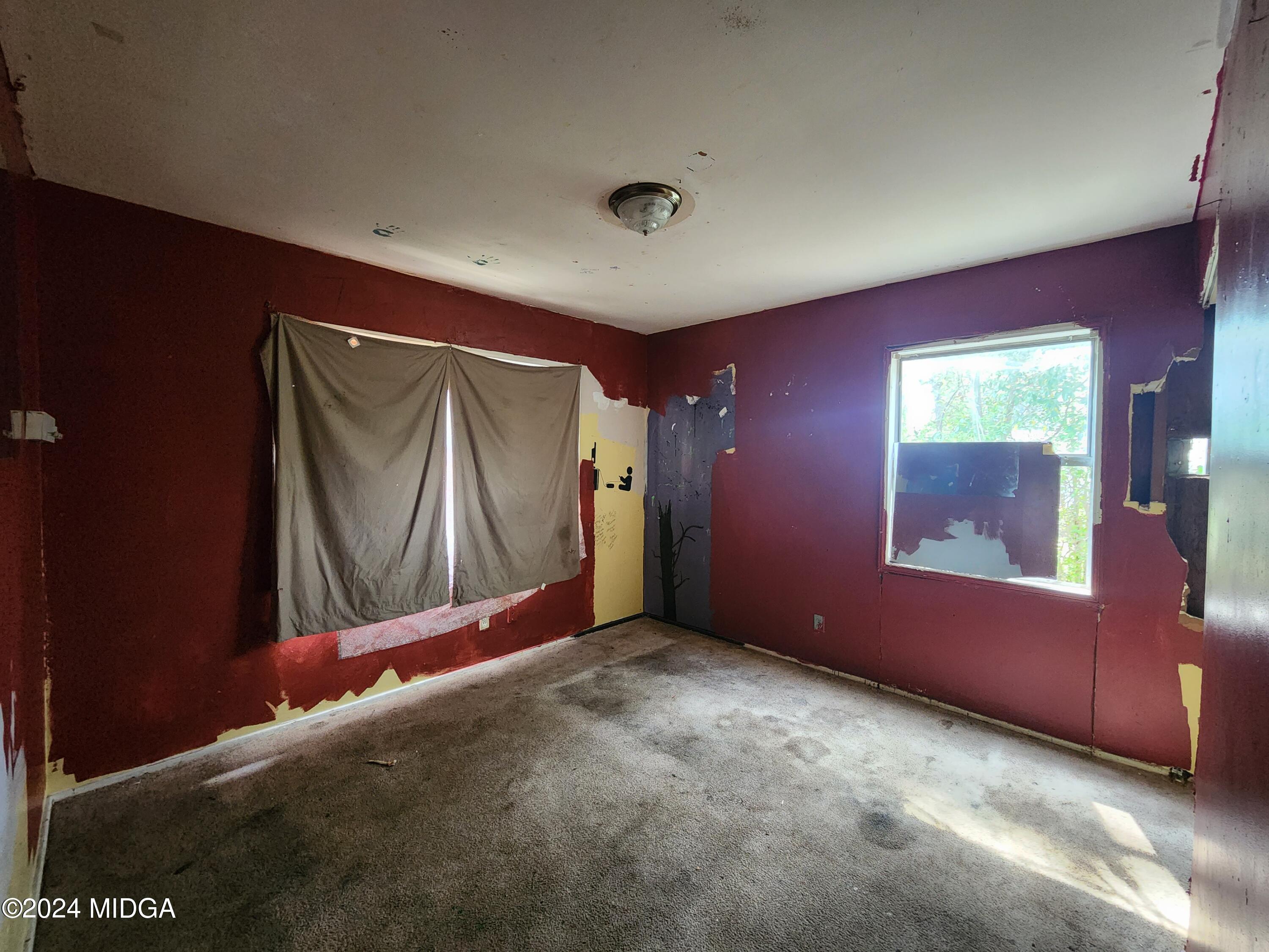 3685 Rice Mill Road Macon, GA 31206 - Photo 17 of 24 a view of empty room with window and ceiling fan
