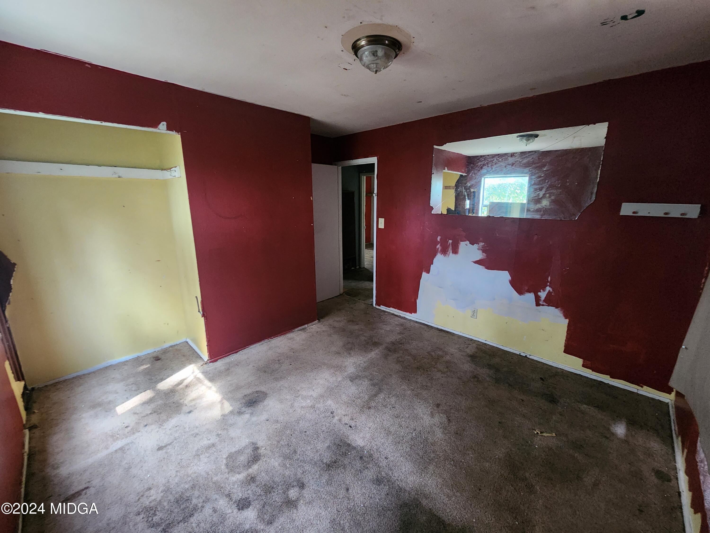 3685 Rice Mill Road Macon, GA 31206 - Photo 18 of 24 a view of a livingroom with wooden floor and a projector