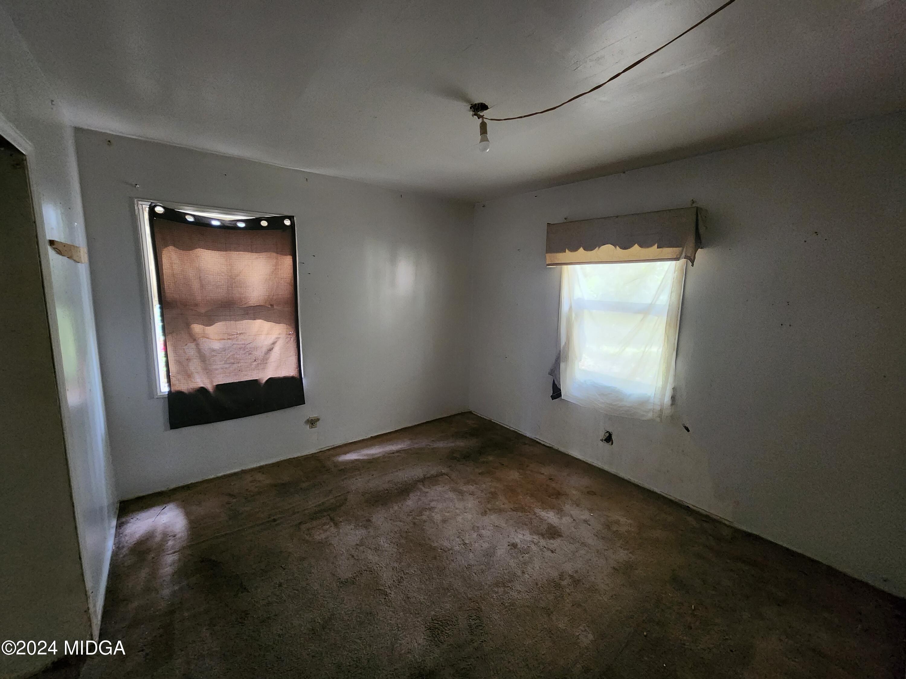 3685 Rice Mill Road Macon, GA 31206 - Photo 19 of 24 an empty room with windows